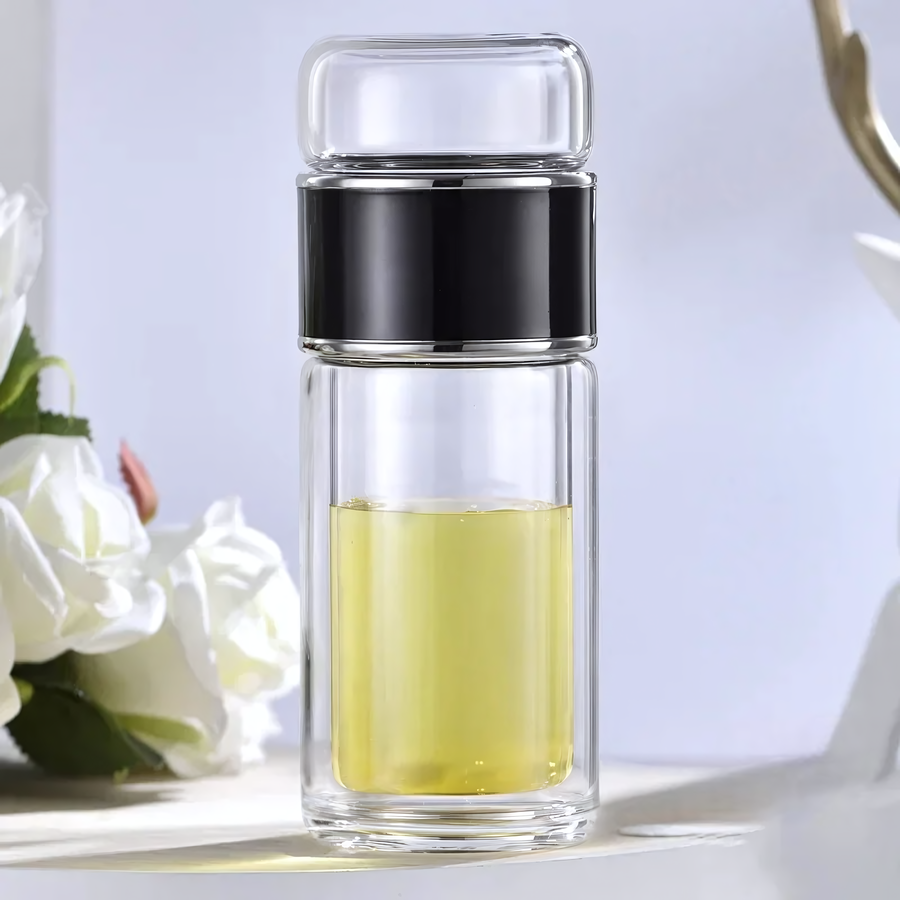 Théière de voyage en verre isolant, design élégant avec couvercle vert, parfaite pour infusions chaudes ou froides