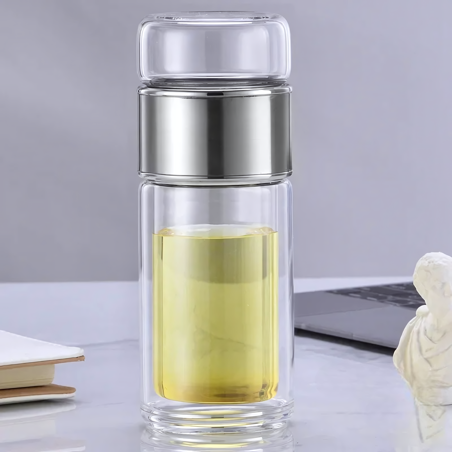 Théière de voyage en verre isolant, design élégant avec couvercle vert, parfaite pour infusions chaudes ou froides