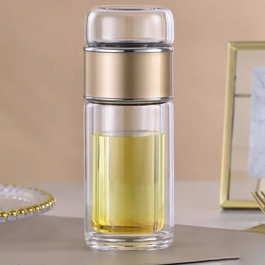 Théière de voyage en verre isolant, design élégant avec couvercle vert, parfaite pour infusions chaudes ou froides